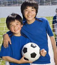 Asian boys with soccer ball