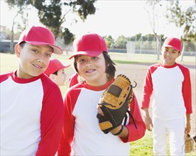 Multi-ethnic boys in baseball uniforms