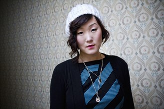 Serious Korean woman in knit cap