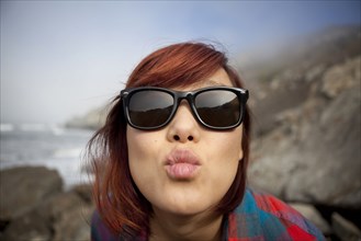 Korean woman puckering her lips