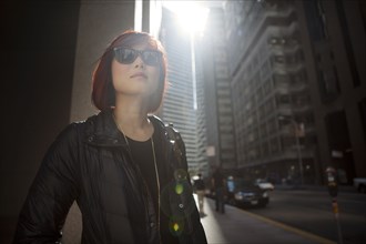 Korean woman walking on city sidewalk