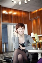 Smiling Caucasian woman in restaurant