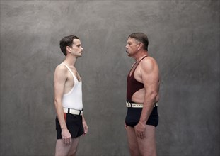 Caucasian wrestlers examining each other