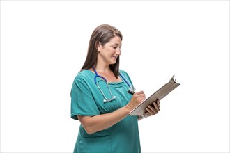 Caucasian nurse writing on clipboard
