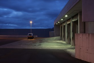 Empty parking lot and cloudy sky at night