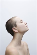 Profile of Caucasian woman with shaved-head