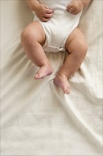 Close up of legs of mixed race baby boy