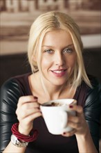 Woman drinking cup of coffee