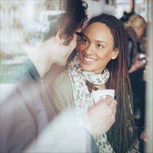 Couple drinking coffee in cafe