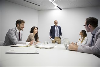 Caucasian business people talking in office meeting