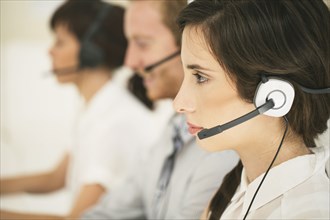 Close up of business people wearing headsets