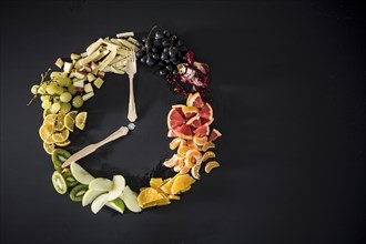 Clock made with fruit