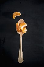 Spoon with orange slices