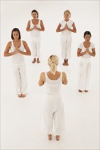 Women meditating in yoga class