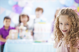 Girl smiling at birthday party