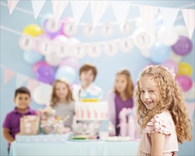 Girl smiling at birthday party
