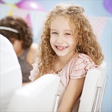 Close up of girl smiling at birthday party