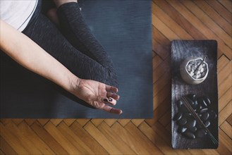 Caucasian woman meditating in yoga studio