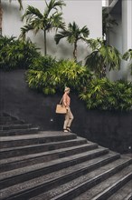 Caucasian woman walking on stairs