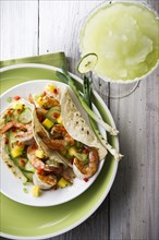 Shrimp tacos and frozen margarita