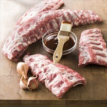 Raw pork ribs with barbecue sauce