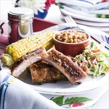 Pork rib dinner with corn and beans