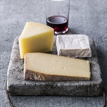 Wedges of cheese and red wine
