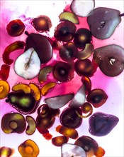 Sliced fruit floating in sangria