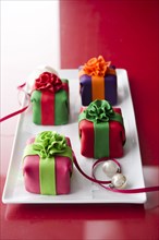 Elegant cheesecake gifts on plate with ornaments and ribbon