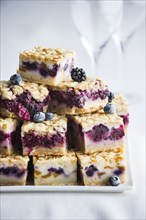 Pile of berry cobbler slices on tray