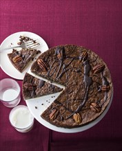 Chocolate pecan fudge tart and milk