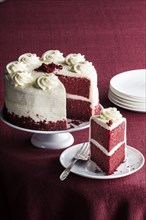 Slice of red velvet cake on plate