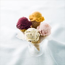 Variety of ice cream cones in glass