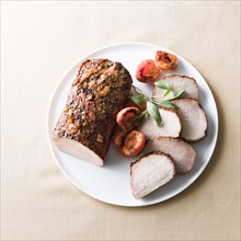 Sliced pork on plate
