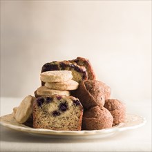 Pile of cookies and breakfast bread on plate
