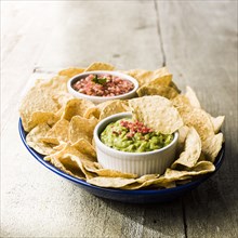 Bowl of chips with salsa and guacamole