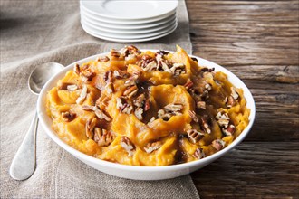 Bowl of sweet potatoes with pecans