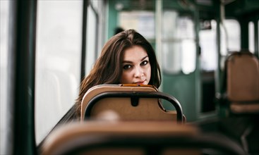 Caucasian woman sitting on bus