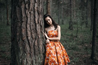Caucasian woman standing in forest