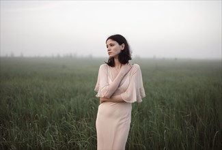 Caucasian woman standing in remote field
