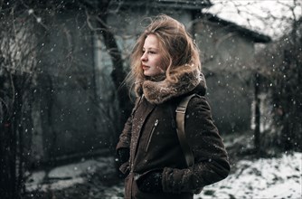 Caucasian woman walking in snow