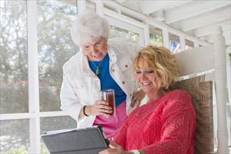 Caucasian women using tablet computer