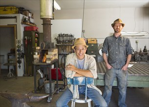Men smiling in workshop