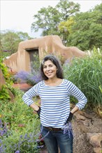Hispanic woman working in garden