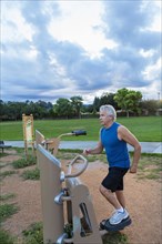 Hispanic man exercising in park