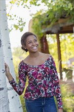 Mixed race teenage girl smiling outdoors