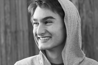 Mixed race teenage boy smiling