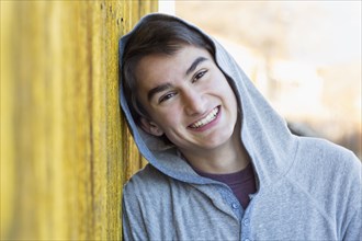 Mixed race teenage boy smiling