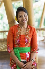 Smiling Balinese woman in traditional clothing