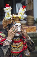 Balinese performer wearing mask and costume